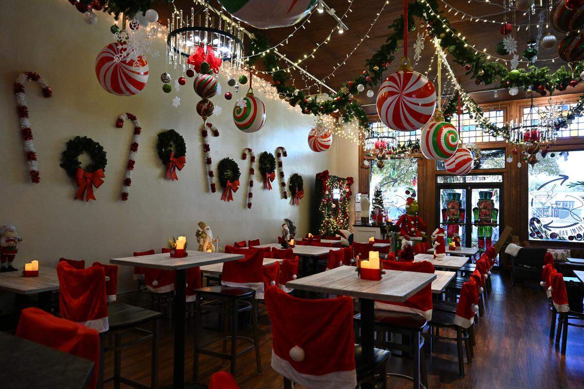 Christmas decorations hang inside of Switch Macon for their “Blitzen A Holiday Bar” theme, on Tuesday, Nov. 11, 2025, in Macon, Georgia. The new bar will rotate through five seasonal themes throughout the year.