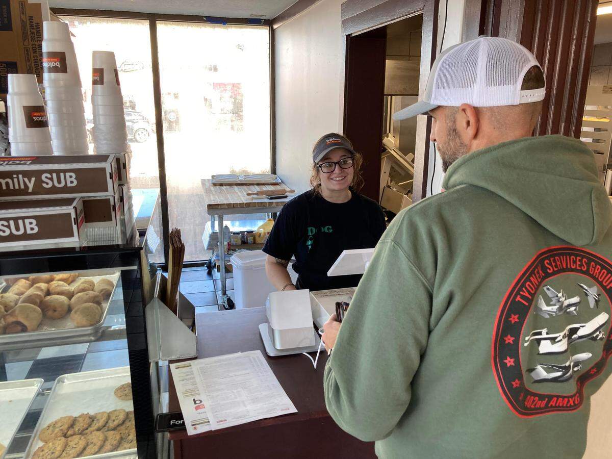 Kellie Dover, general manager of the new Baldinos Giant Jersey Subs in Warner Robins, takes an order from a customer. Dover was the general manager of the former Mike’s Hot Dogs & Hamburgers, which was previously housed in the building that is now home to the new Baldinos.