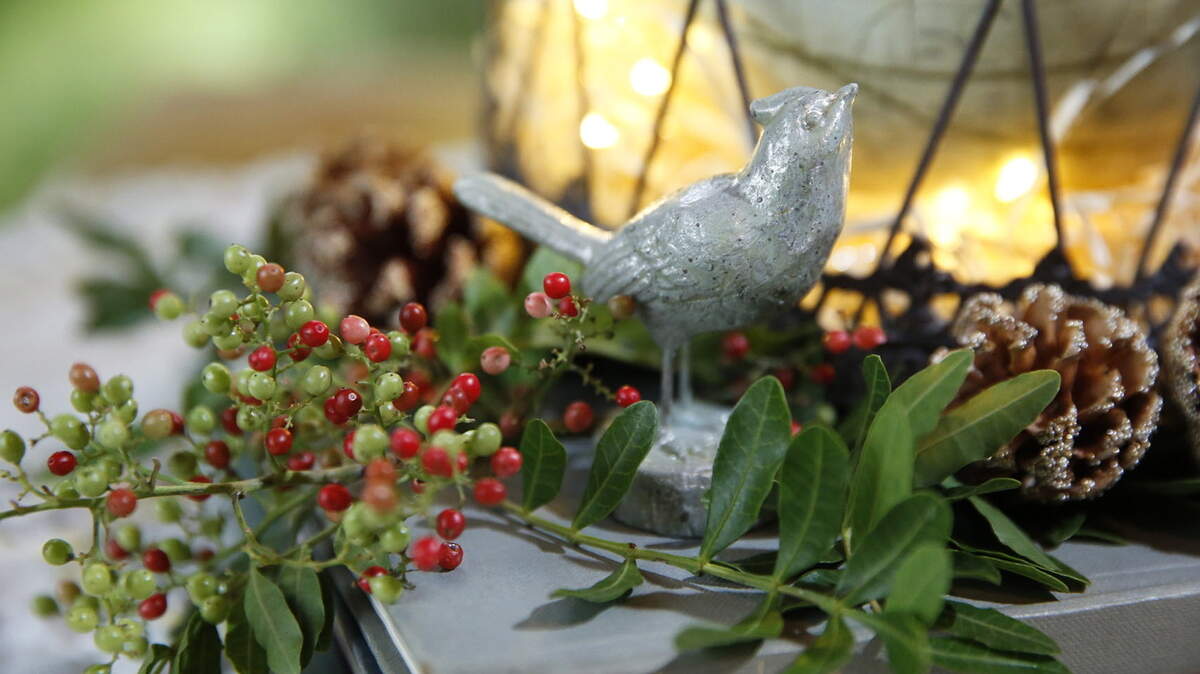 A figure of a small bird was used in a centerpiece by designer Ashley Brown.