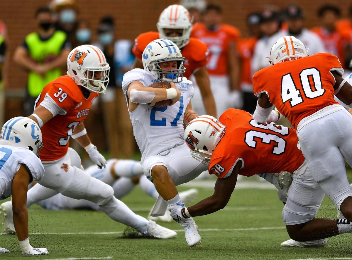 DONN RODENROTH,Macon, Georgia, 02/27/2021: Citadel A-Cooper Wallace gets tripped up by Mercer’s Julian Beris in action Saturday in Macon.