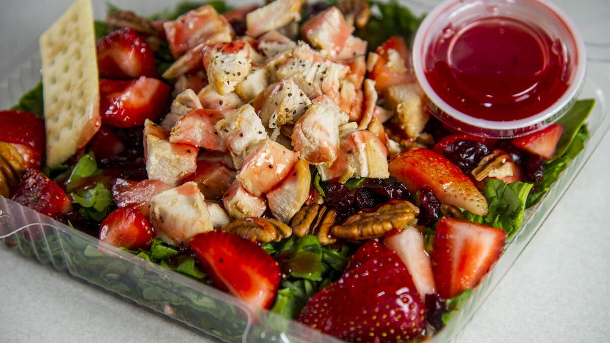 Among the menu options at Salads 2 Go is a spinach and strawberry salad with grilled chicken.