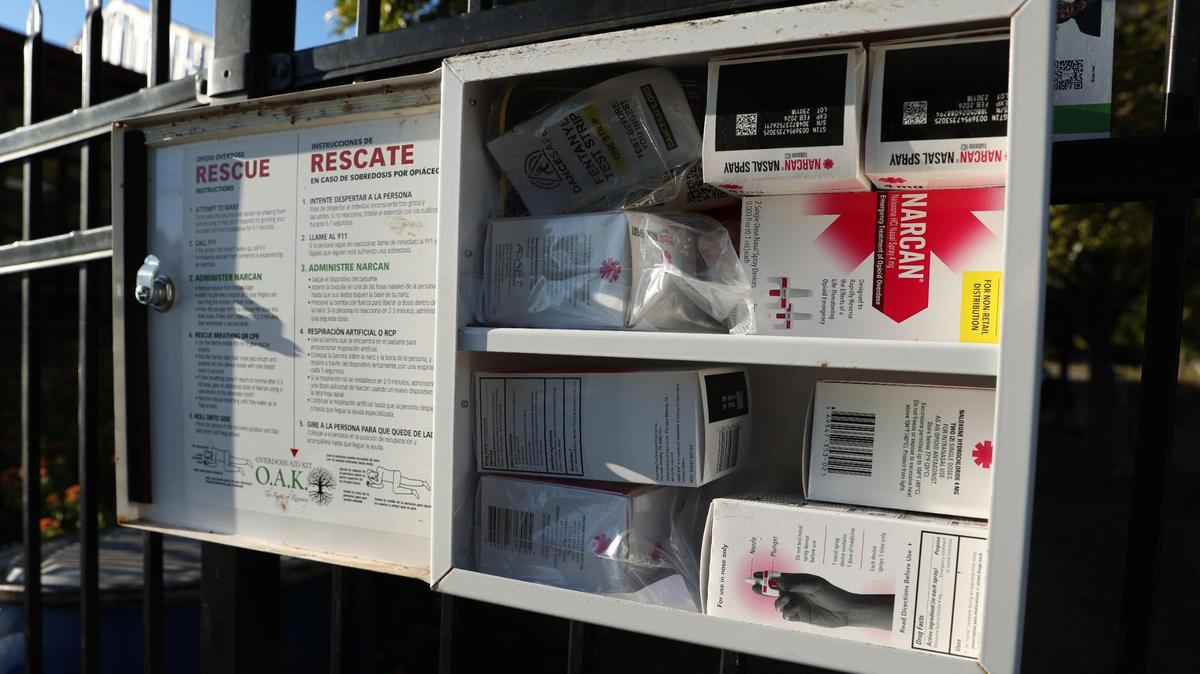 An Overdose Aid Kit sits on the fence outside of Daybreak on Friday, Oct. 18, 2024, in Macon, Georgia. The box is one of four across Macon supported by nonprofit Macon Recovers and allows anyone to access Narcan and fentanyl testing kits for free.