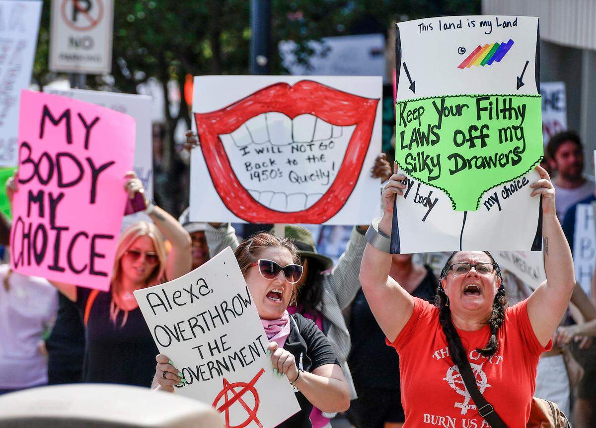Hundreds of protesters march along Cotton Ave. Sunday during a pro-choice march and rally Sunday in downtown Macon.