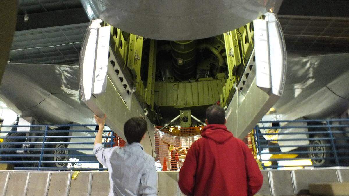 Attendees examine a B-29 bomber at the Museum of Aviation during the 2014 Night at the Museum.