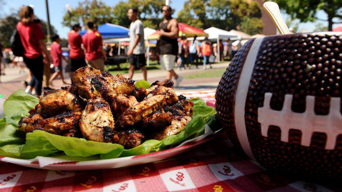 Chipotle chicken wings served with blue cheese dip at a USC tailgate party.