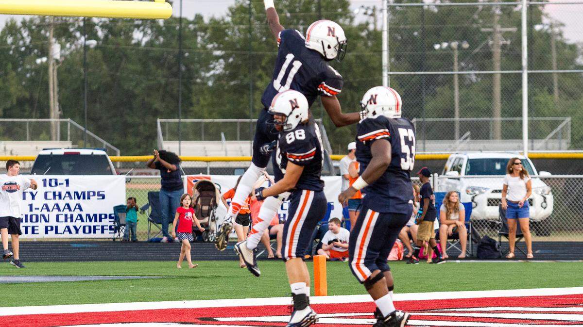 Northside’s Jaylan Sandifer (11) celebrating after scoring a TD against Evans in the 1st quarter of their game Friday night.