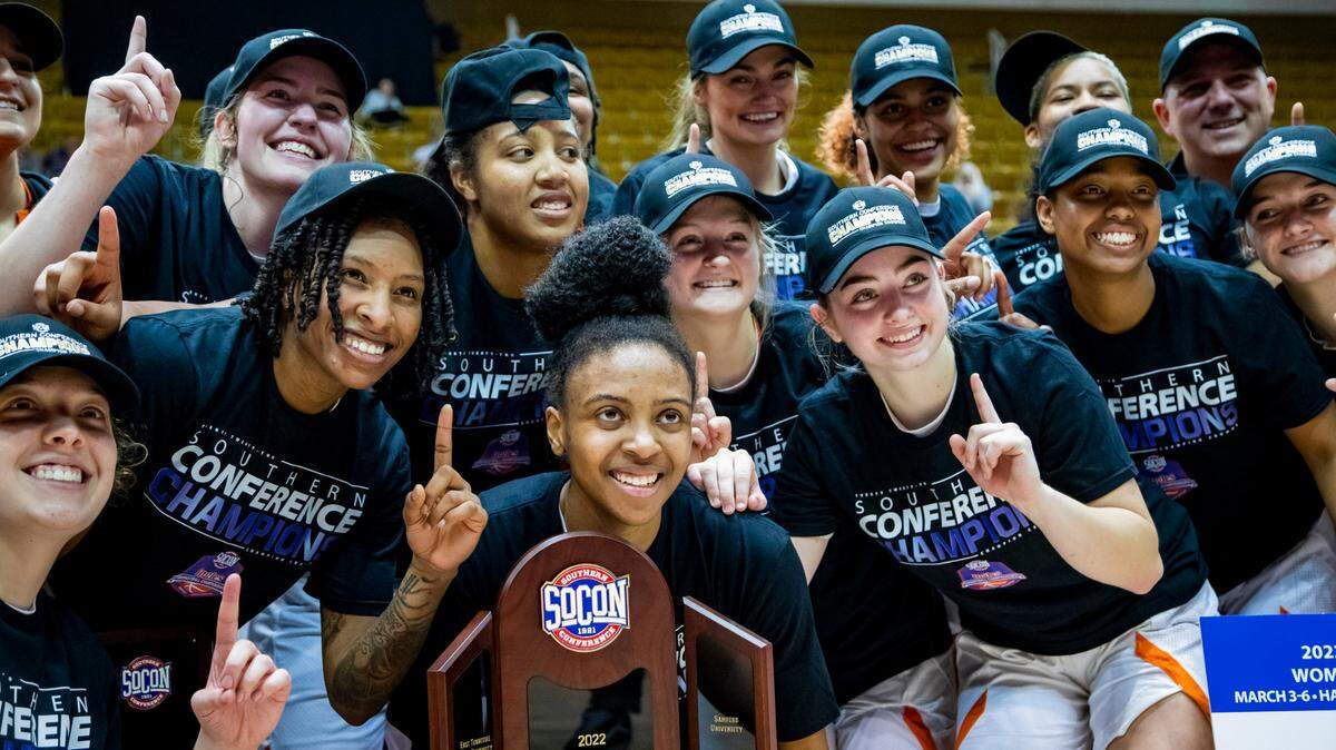 The Mercer women’s basketball team celebrates after defeating Furman 73-54 in the SoCon Ingles Basketball Championship Saturday afternoon at the Harrah’s Cherokee Center in Asheville, N.C.