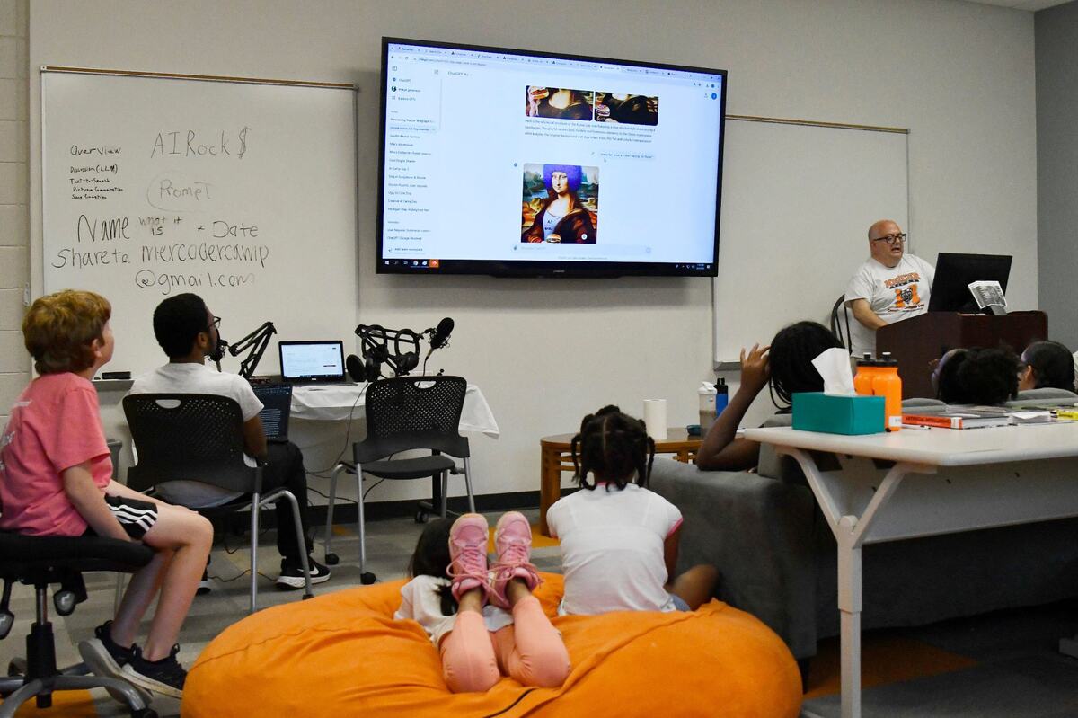 AI Explorers camp teacher Joe Finkelstein shows off one of the ChatGPT activities from AI Explorers camp on Wednesday, June 5, 2024, in the Willet Science Center at Mercer University. AI Explorers is a part of the Mercer Creative Computer Camp, which teaches elementary and middle school students about different technical skills during the summer.
