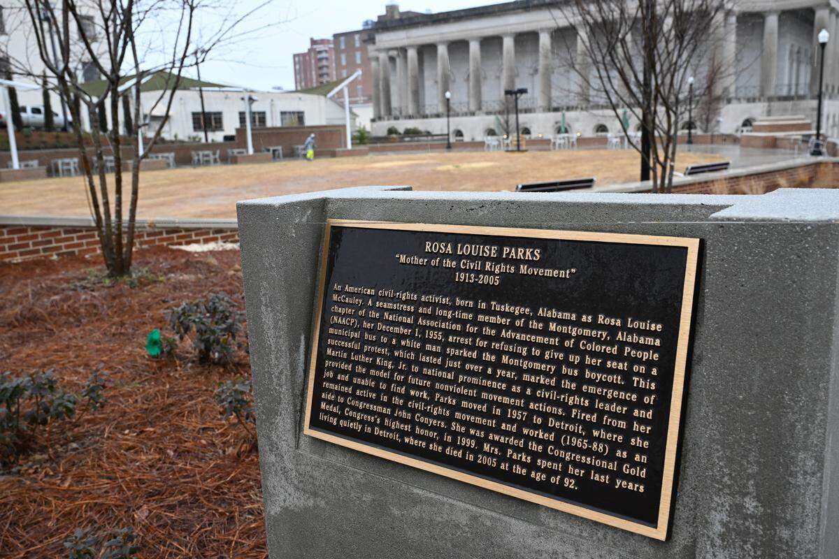 A plaque with a biography of Rosa Parks sits on the edge of the new park named after her on Wednesday, Feb. 4, 2026, in downtown Macon, Georgia. The ceremony to honor Rosa Parks’ birthday and the grand opening of the park was moved inside city hall due to rain.