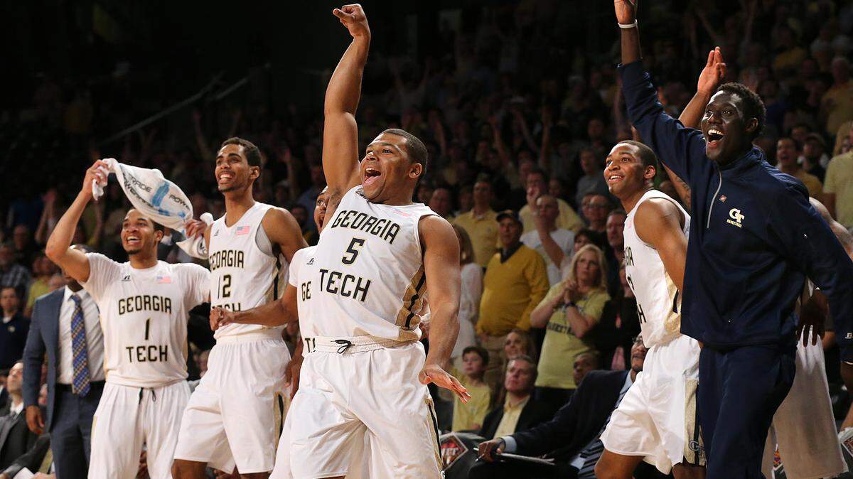 Georgia Tech guard (5) Corey Heyward and the bench react as he hits a 3-pointer near the end of the game against Houston in NCAA college basketball matchup in the first round of the NIT, Wednesday, March 16, 2016, in Atlanta. Georgia Tech won 81-62. (Curtis Compton/Atlanta Journal Constitution via AP)