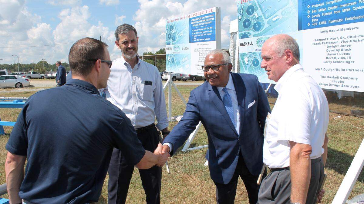 From right, Ray Shell, MWA executive vice president of plant and field operations, introduces MWA Chairman Sam Hart to Tom Kelley, second from left, project manager with Jacobs Engineering, and Michael Hoisington, far left, Haskell’s senior project manager for water during the Pipe Turning Ceremony for the authority’s waste water treatment plant project.
