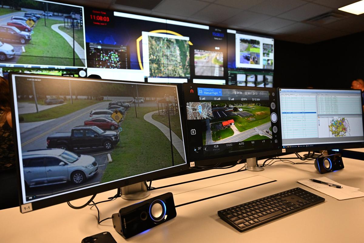 Surveillance footage sits displayed on screens inside of the new Real Time Crime Center on Tuesday, June 17, 2025, at the Law Enforcement Center in Warner Robins, Georgia. The Real Time Crime Center brings traffic cameras, license plate readers, public safety databases and social media monitoring information into one centralized hub for the WRPD to analyze as events occur.