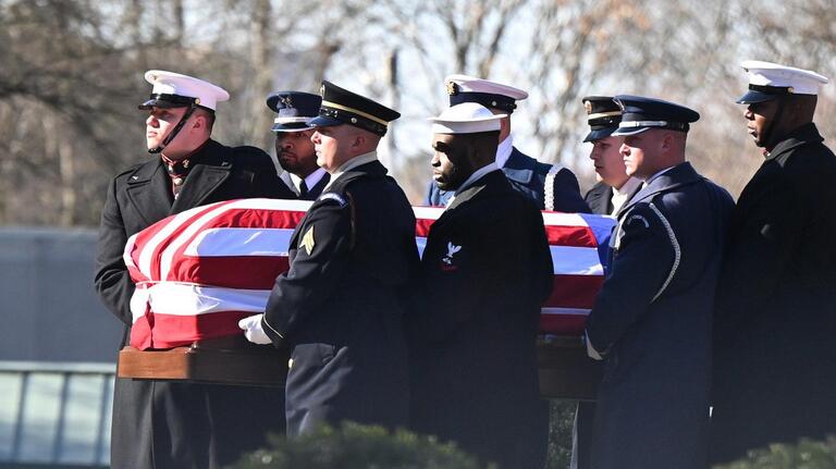 Spectators bid Jimmy Carter a final goodbye before he leaves Atlanta for Washington, DC