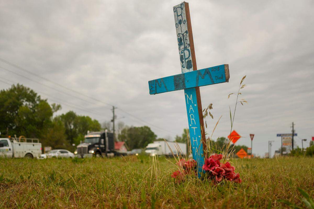A roadside memorial for a Martha Ard, killed in 2015 at this spot in Macon where three major arterial roads funnel into US 247 South. Four pedestrians have been killed near the spot since 2006.