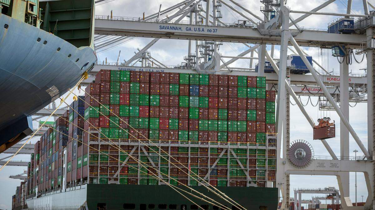 In this 2021 provided photo, a vessel is loaded with containers by a ship to shore crane in Savannah. The chief executive over Georgia’s seaports says larger cargo ships will need deeper water and a taller bridge to reach the port.