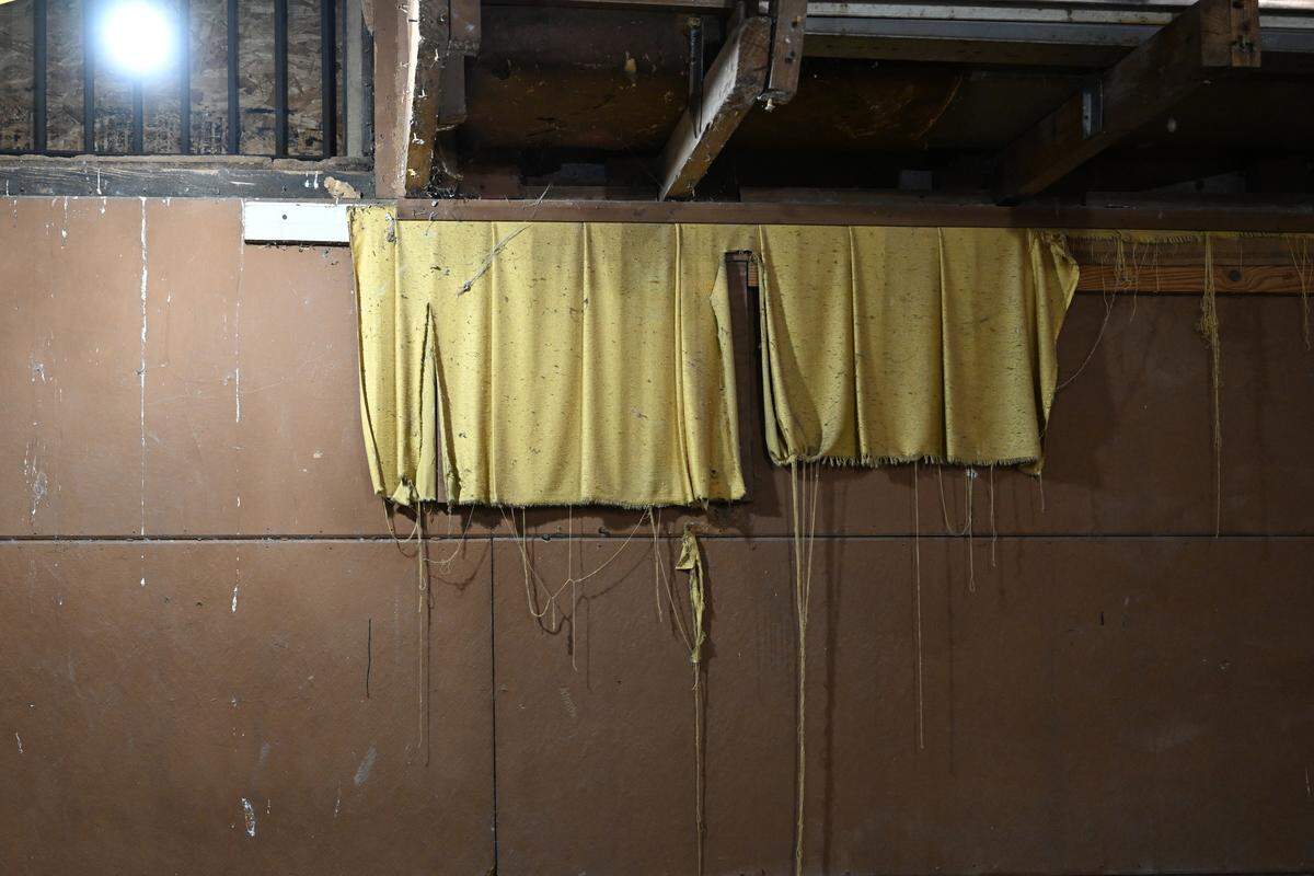 Old curtains from the Bibb Theatre dangle from side of the theater ahead of renovations on Thursday, Feb. 5, 2026, in downtown Macon, Georgia. The Bibb Theatre operated from 1938 to 1978 and has sat abandoned since.