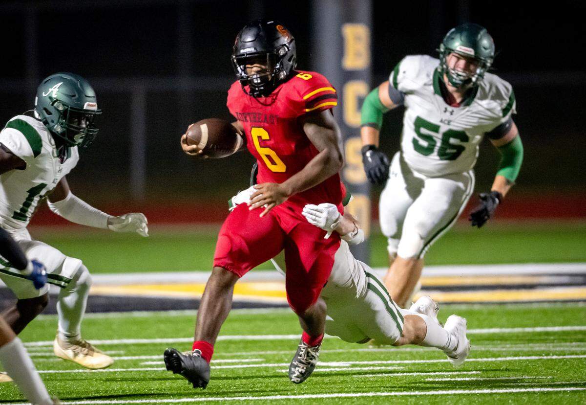 Northeast running back Nick Woodford (6) breaks a tackle during the Raiders’ 52-26 win over ACE Friday night.