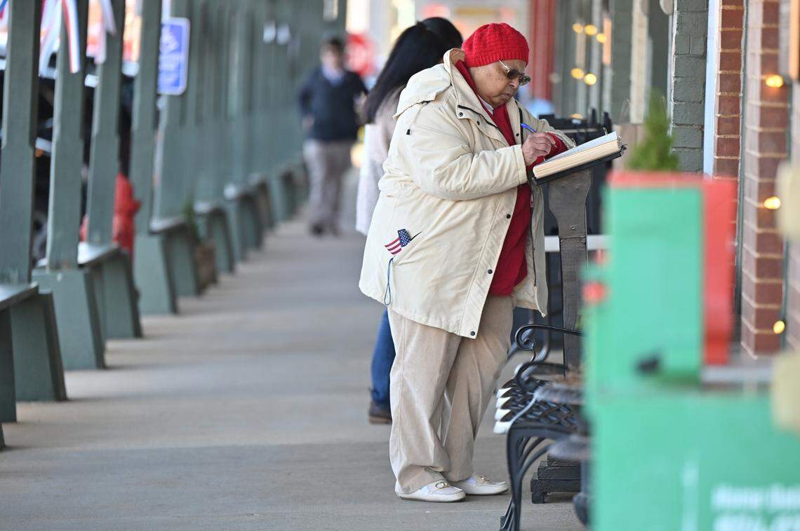 Mattie Wright, 73, from Albany, Georgia, signs the condolence book in memory of former president Jimmy Carter on the day of former president Carter’s funeral in his hometown of Plains on Thursday, Jan. 9, 2025, in Plains, Georgia. Wright grew up in Plains and attended Georgia Southwestern State University in Americus, Georgia, with Chip Carter, Jimmy Carter’s son.