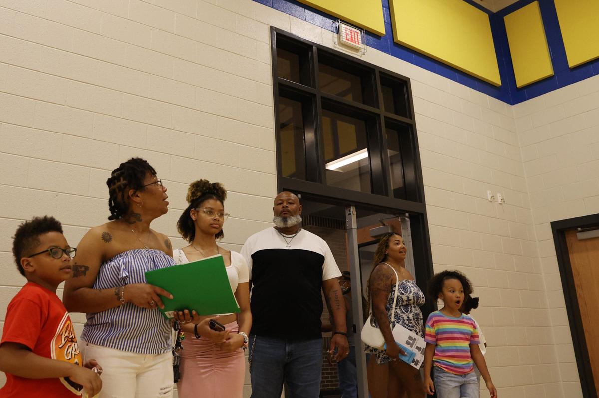Springdale Elementary School students and families react to the brand new gymnasium during open house on Friday, Aug. 2, 2024, in Macon, Georgia. The original Springdale Elementary opened 53 years ago, but this brand new building completed this summer will be ready for the new school year starting Aug. 5.
