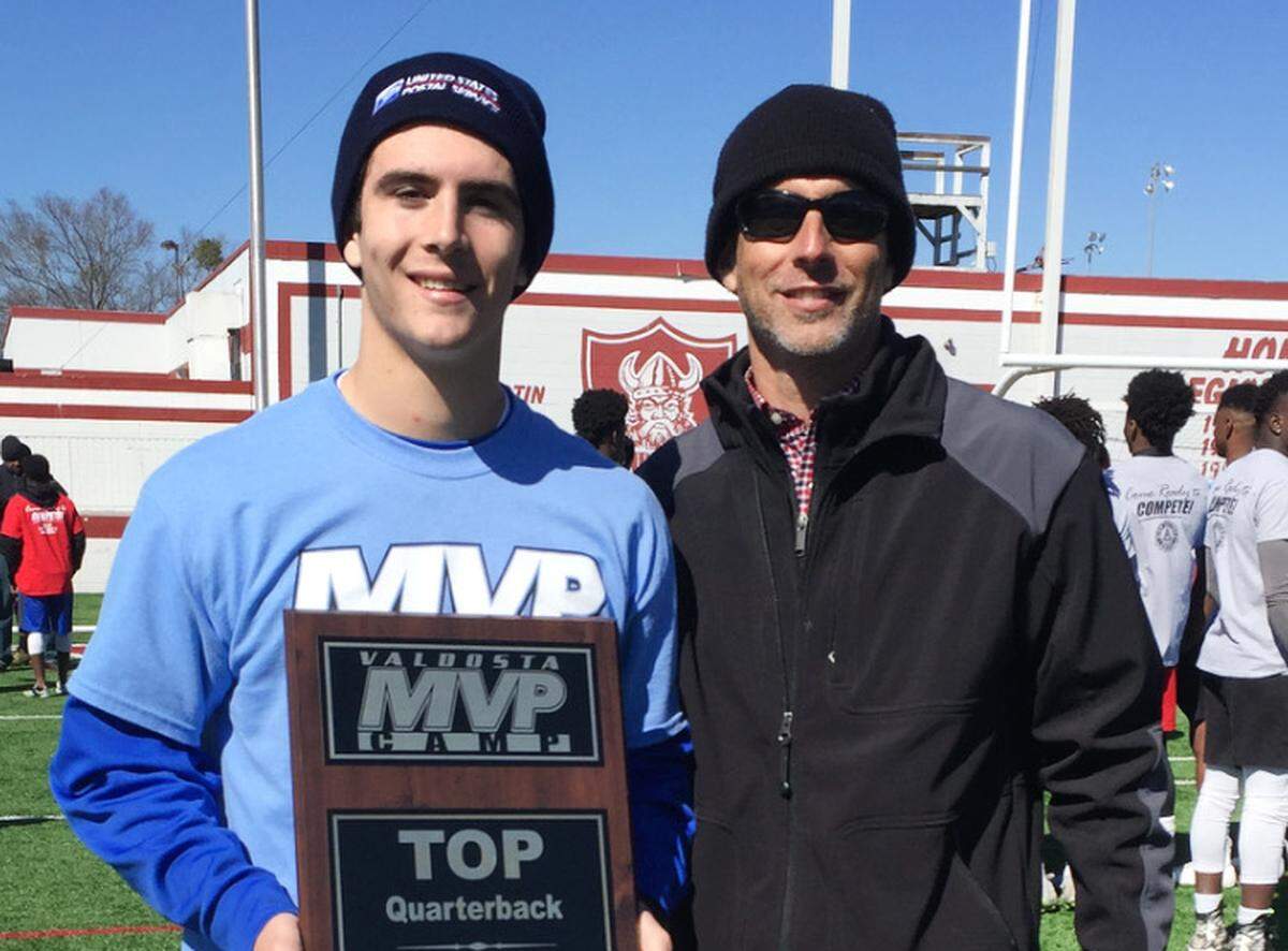 Stetson Bennett with his dad after being named the top QB at a recruiting event in Valdosta, Georgia