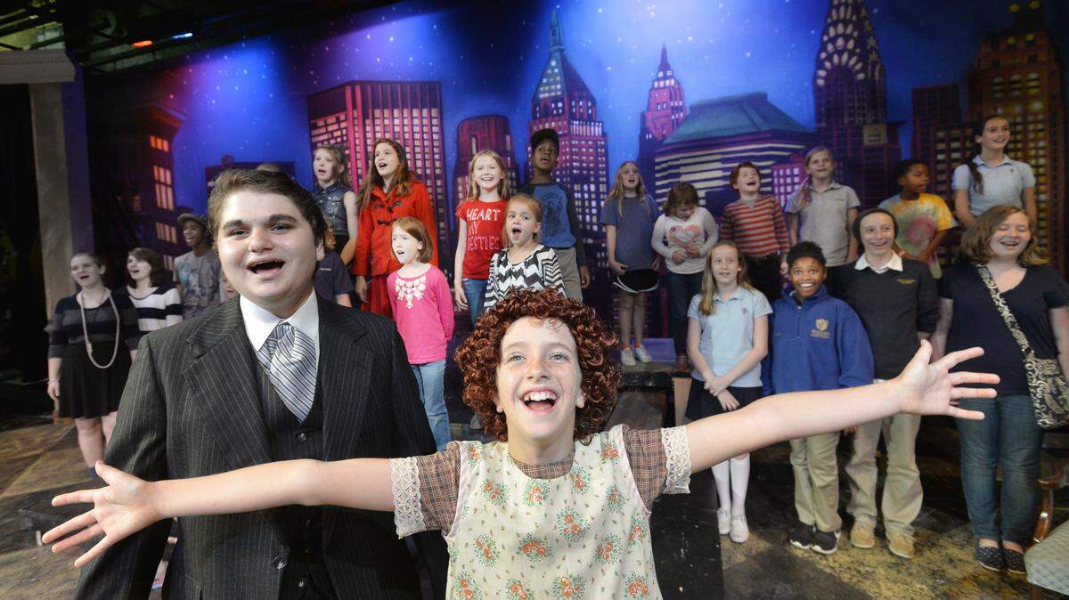 BEAU CABELL/THE TELEGRAPHMia Pendergast, center, is Annie in Theatre Macon's Youth Actors Company's production of "Annie Jr.," which opens Friday.