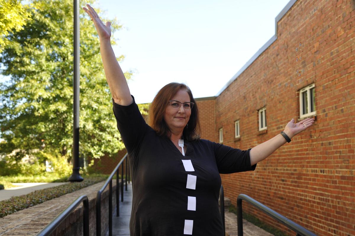Liz Fabian, a reporter with The Macon Telegraph, models a halloween costume called “A fork in the road.”