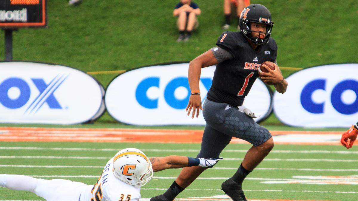 Mercer quarterback Kaelan Riley (1) keeps the ball for a short gain against Chattanooga on Oct. 14.