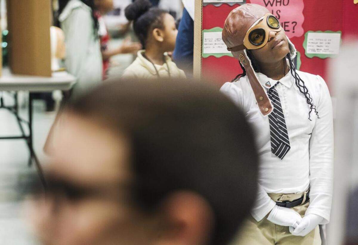 Student Jaleigh Rhodes in between recitations of the life story of Bessie Coleman, the first Black woman in the nation to be a licensed pilot.