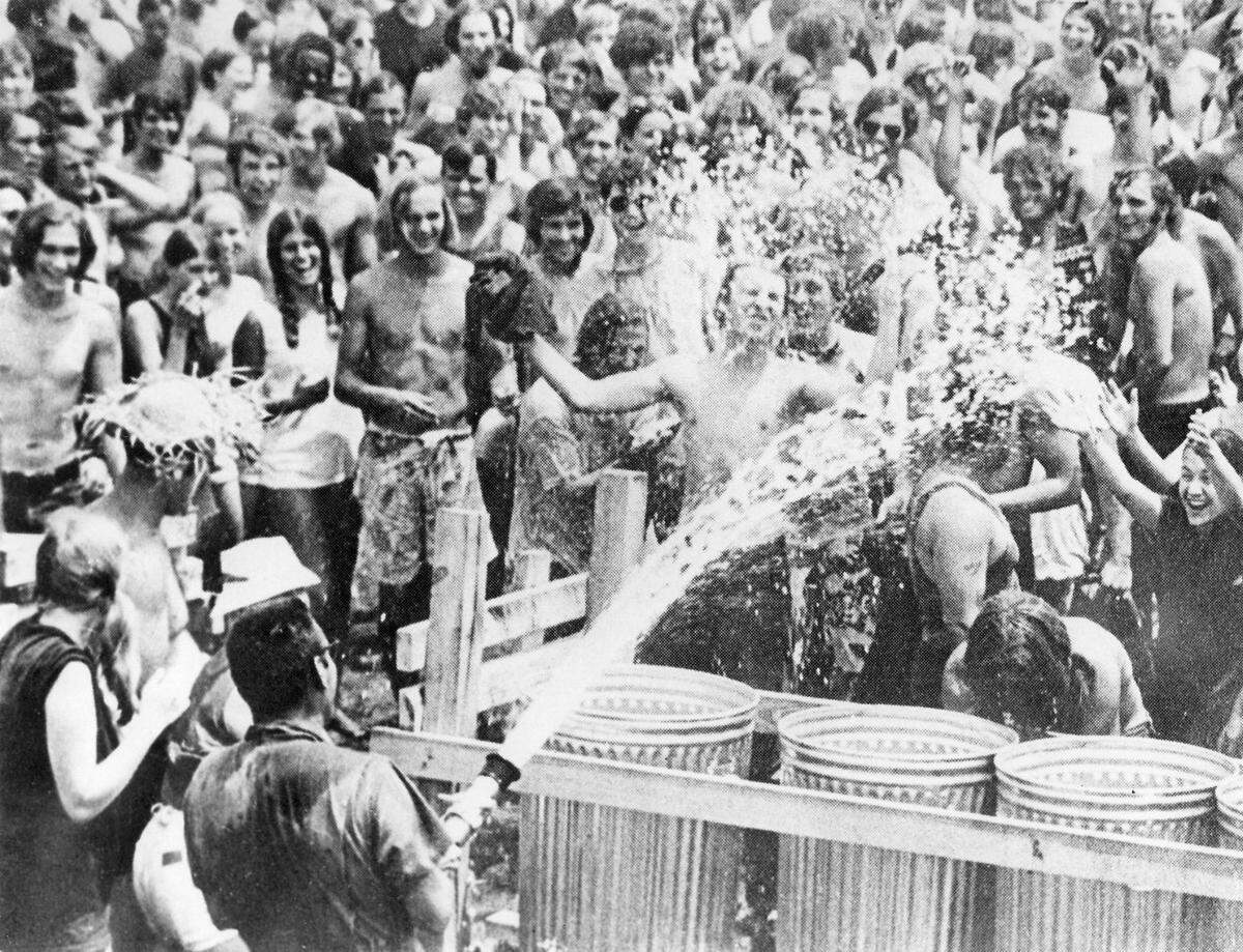 MACON TELEGRAPH FILE PHOTO Byron, Ga. July, 1970 A fire truck cooling off concert goers at Second Annual Atlanta International Pops Festival held in Byron, Ga. July 3-5, 1970 at the Middle Georgia Raceway.