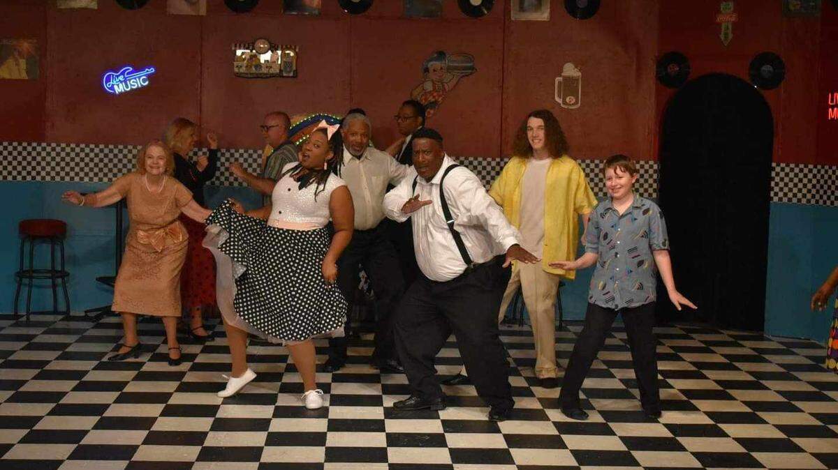 Cutline: Cast members from the Warner Robins Little Theatre play “America’s Top 40: Hits From the 60s, 70s & 80s” dances to the song “Do You Love Me” by The Contours. Photo by Renee Alday.