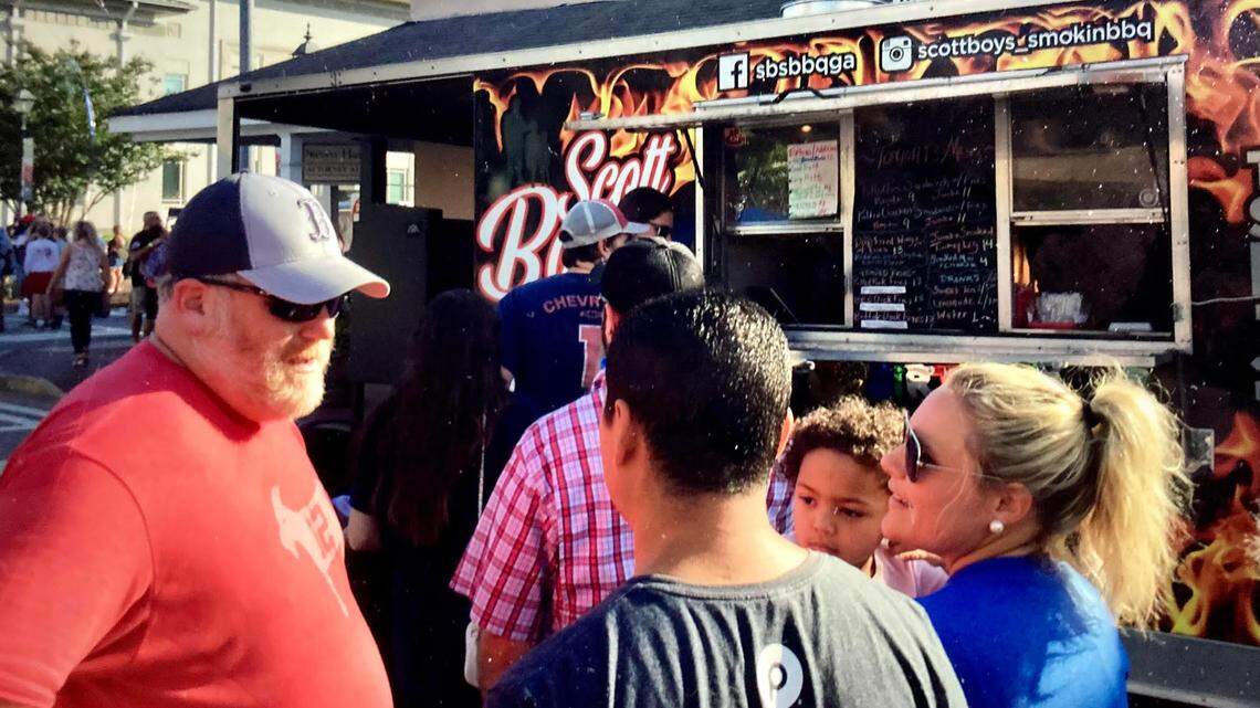 Food Truck Friday returns to downtown Perry on July 15. In this May 2021 Telegraph file photo, people chat in front of Scott Boys Smokin’ BBQ at a Food Truck Friday in downtown Perry. Scott Boys Smokin’s BBQ returns to the July 15 event.