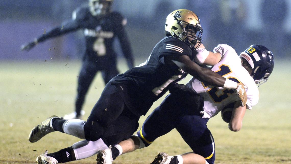 Mary Persons linebacker Ladamion Sands (16) sacks Marist quarterback Connor Cigelske (13) Friday night during a scoreless first half of their quarterfinal game.
