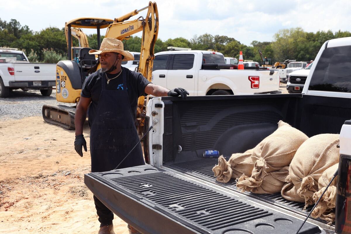 Jeff Thompson watches as sand bags are packed into the back of his truck in preparation for Hurricane Helene on Wednesday, Sept. 25, 2024, at the City of Warner Robins Public Works Office in Warner Robins, Georgia. Thompson works at Sea Ways Seafood II and grabbed sandbags for the business to prepare for potential flooding.
