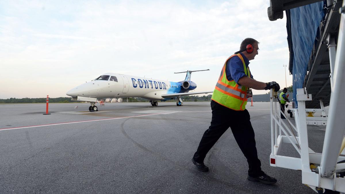 A worker at Middle Georgia Regional Airport. A company contracted to do work at the airport is suing Macon-Bibb County, alleging it wasn’t paid for partial work done when the county canceled a construction contract.