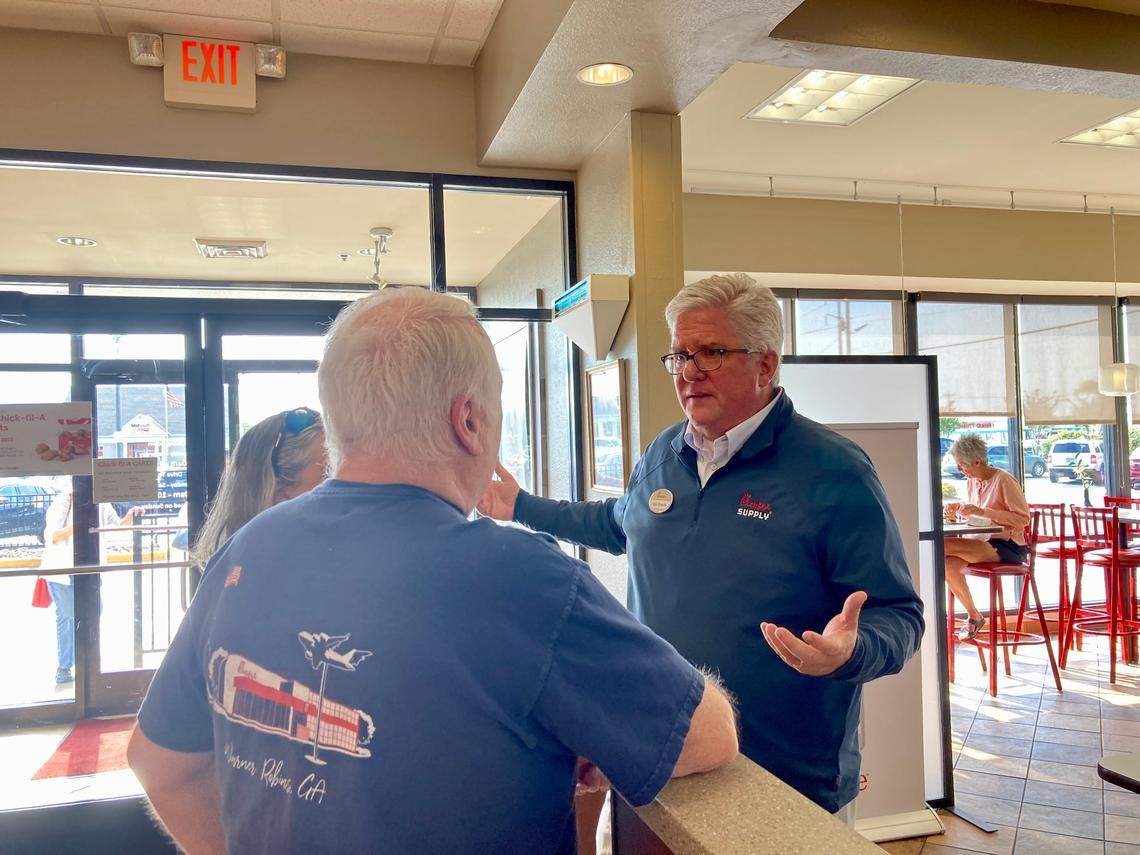 Chick-fil-A owner and operator Pat Braski talks with customers during the “last bite” event at the restaurant at 1867 Watson Blvd. last week before it closed Friday. The restaurant’s new location at 621 Russell Parkway opens Thursday.