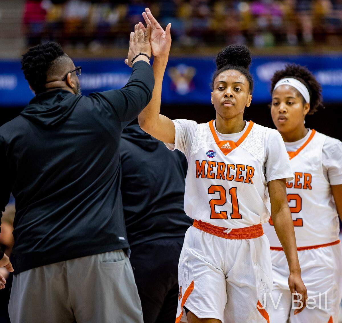 Mercer graduate student guard Shannon Titus high-fives a coach as the Bears face Samford Friday morning during the SOCON Ingles Championships at the Harrah’s Cherokee Center in Asheville, N.C.