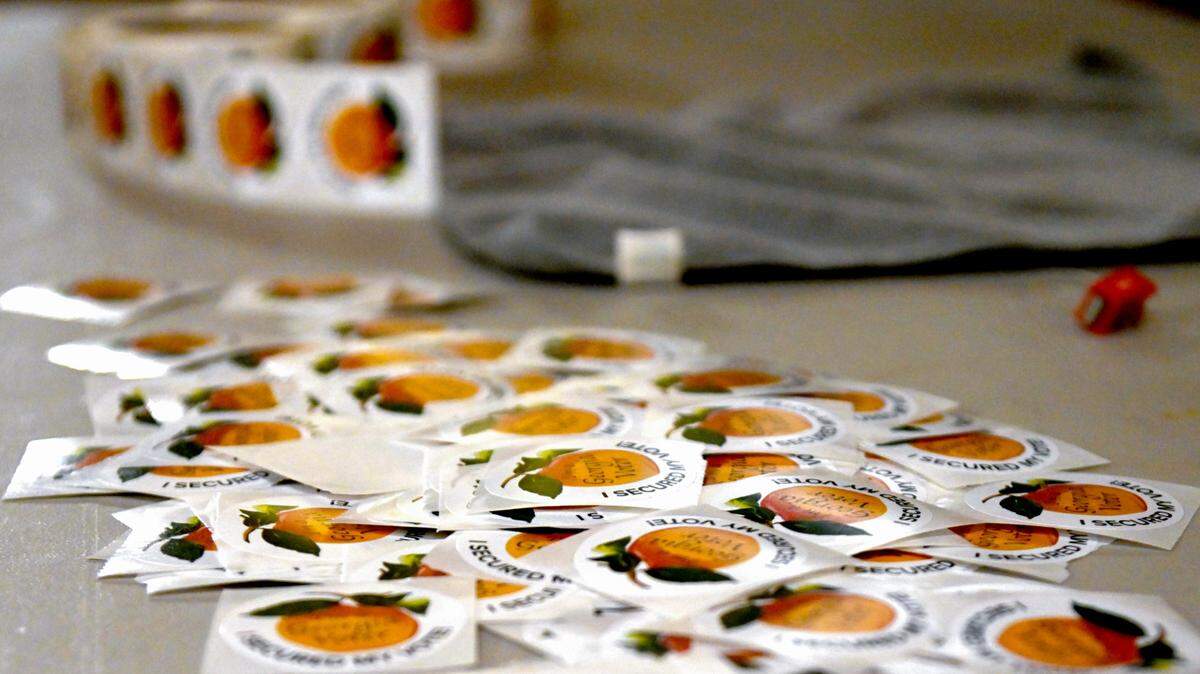 Voting stickers lie on a table at a Macon polling place. Georgians voted in runoff elections Tuesday.