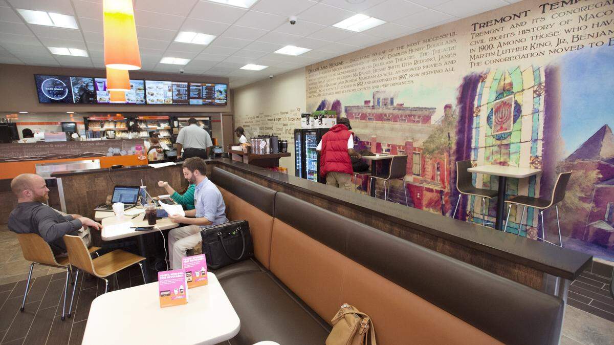 The new Dunkin' Donuts features murals of the Douglass House and Tremont Baptist Church.