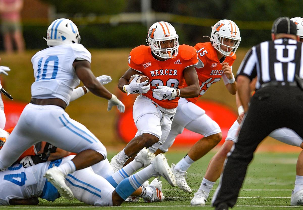 DONN RODENROTH,Macon, Georgia, 02/27/2021: Mercer running back Julian Beris busts out of the backfield on his way to first down Saturday against The Citadel. Mercer defeated The Citadel 42-28.