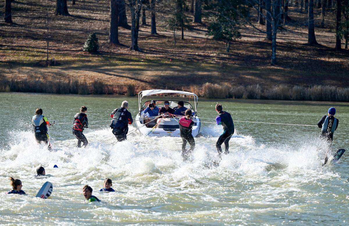 Members of the Lake Tobesofkee Water Ski Club enjoyed a sunny on the water Monday on a private lake in North Macon. Fifteen skiers braved the cold water to continue a New Year’s Day tradition that started in 1988. The group couldn’t ski at Lake Tobesofkee because water levels were recently lowered to allow property owners to perform repair work on their docks.