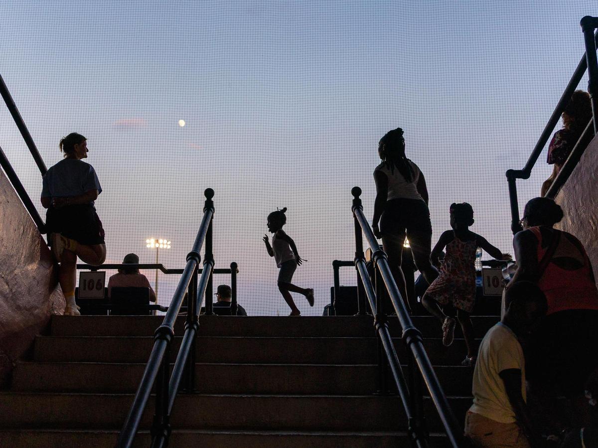 Attendees climb the stairs to Luther Williams during the Coastal Plains League All-Star Game on Monday, July 7, 2025, at Luther Williams Field in Macon, Georgia. The summer baseball collegiate Coastal Plains League, which includes the Macon Bacon, hosted its annual All-Star Game in Macon this year for the first time in the game’s 24 year history.