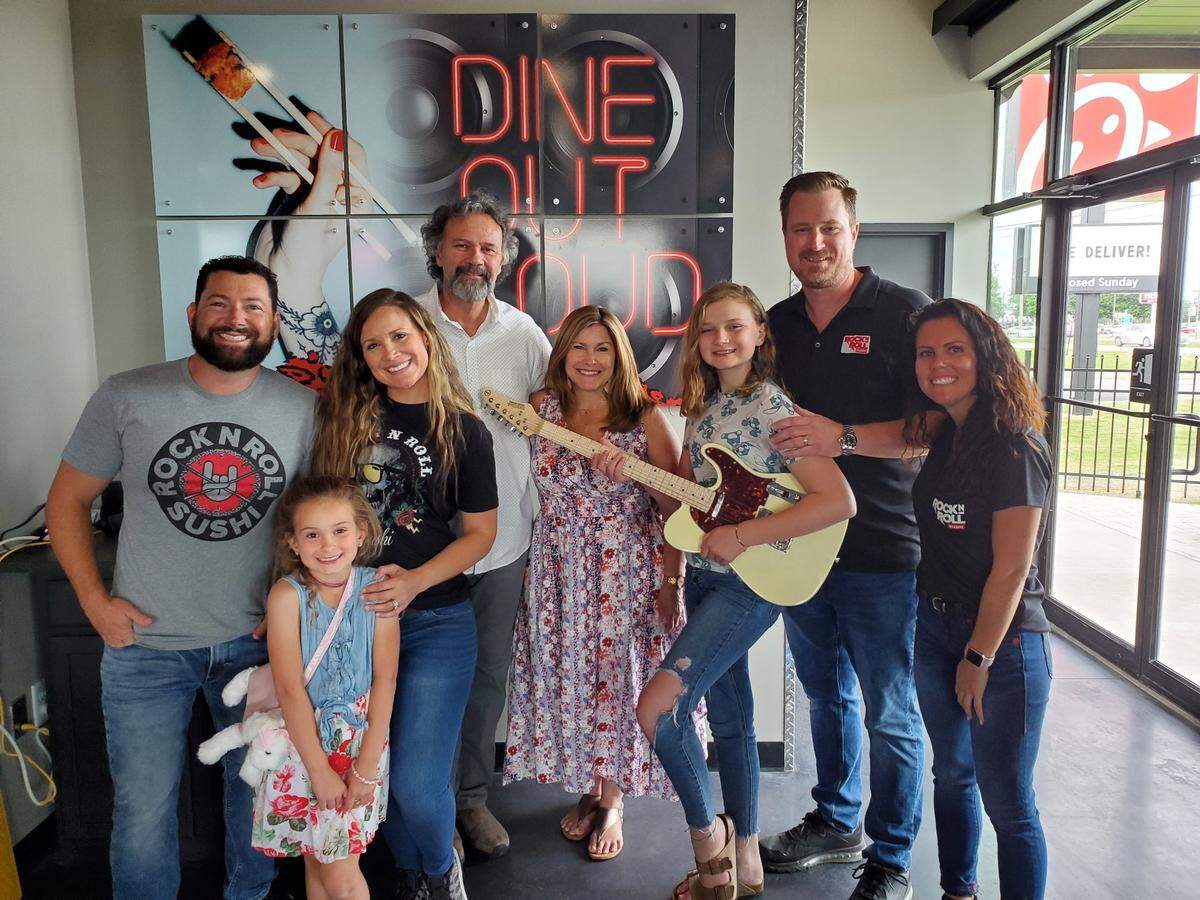When Tim and Alisa Prussia opened their second Rock N Roll Sushi location in Warner Robins, they had this photo taken with their family and business partner Eric Robison. From left, Robison, Catelin Prussia, Alisa Prussia, Rusty and Tina Garner, Savannah Prussia, Tim Prussia and Robison’s fiancee Toni Powell.