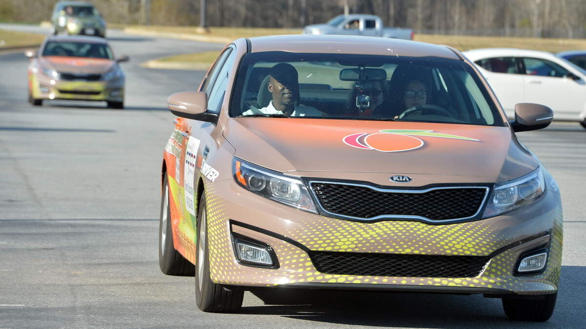 Driver eduction instructor Milton Spivey, left, sits in the passenger seat as Makayla Leal takes the wheel and works on her parking skills outside Veterans High School. Instruction in the classroom of 30 hours and six hours behind the wheel driving in all types of conditions qualified students to receive a certificate.