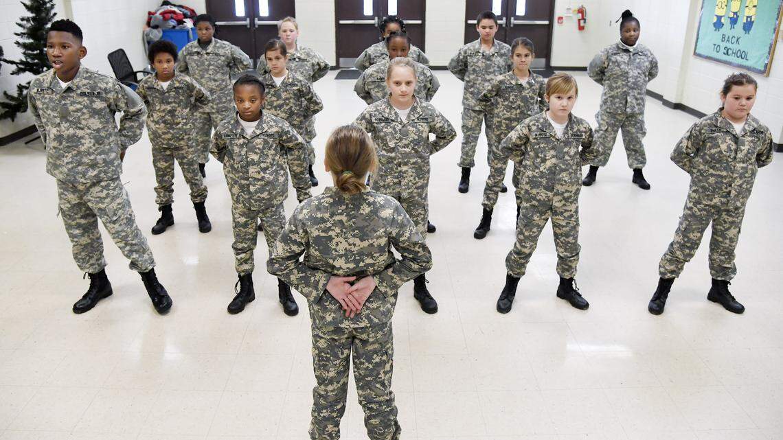 Byron Elementary School Junior ROTC Lt. Elliott Colson Jr., left, says his name during roll call at school Jan. 8. The Peach County school system is now a charter system, which allows more flexibility for the district and individual schools. Byron Elementary Principal Keith Lauritsen said his school has been able to implement the JROTC program and added 20 extra instruction minutes to the day since the district became a charter system.