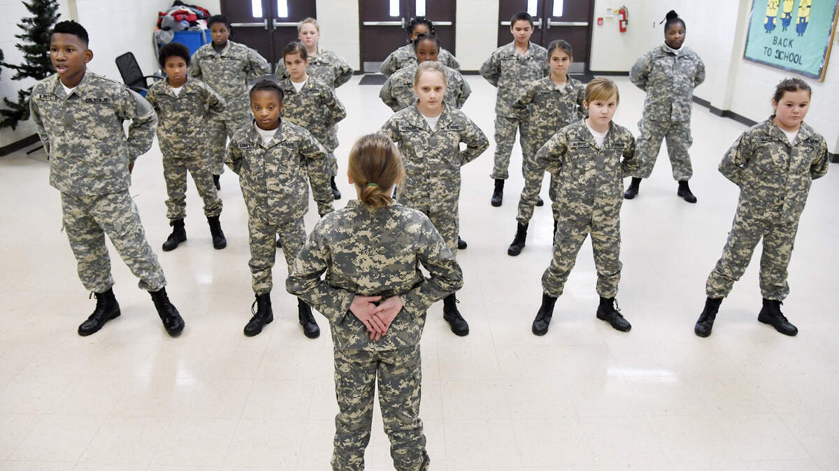 Byron Elementary School Junior ROTC Lt. Elliott Colson Jr., left, says his name during roll call at school Jan. 8. The Peach County school system is now a charter system, which allows more flexibility for the district and individual schools. Byron Elementary Principal Keith Lauritsen said his school has been able to implement the JROTC program and added 20 extra instruction minutes to the day since the district became a charter system.