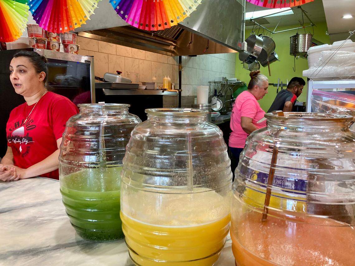 Freshly made agua frescas, a light fruit drink popular in Mexico, are a mainstay at Taqueria la Pina Loka in Warner Robins. The authentic Mexican restaurant in Warner Robins is owned by Beatriz Aguilar, left, and her mom, pink shirt, helps her with the cooking as needed.