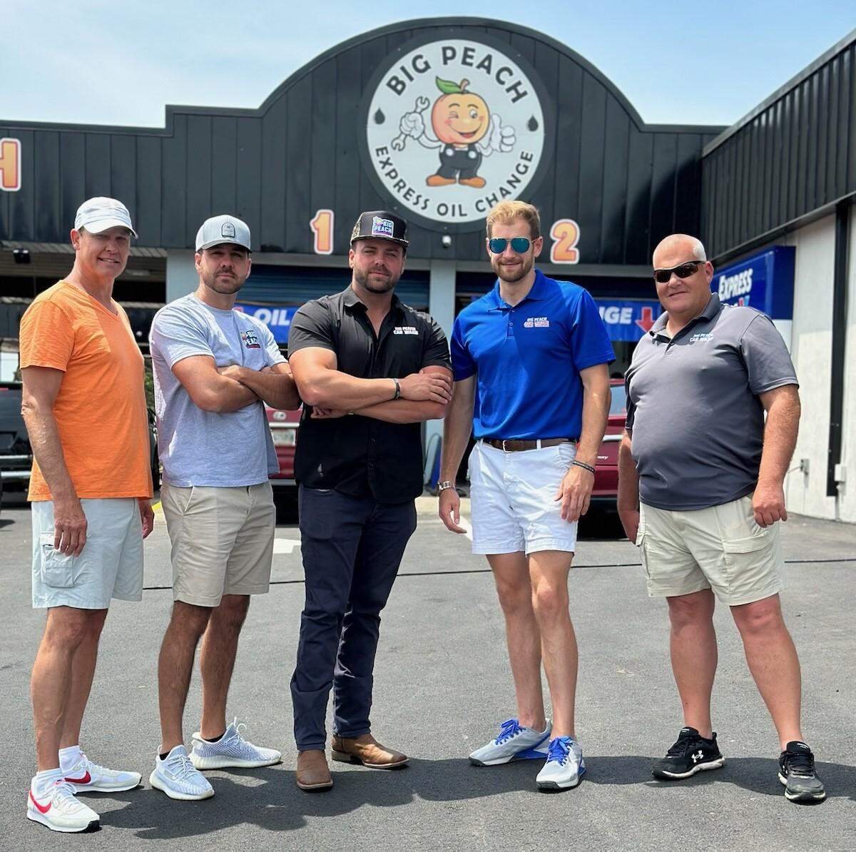 Pictured from left, Todd Rivers, Wes Cone, Jeffery Mark Shepherd, Jon Michael Shepherd, and Mike Conard, owners of Big Peach Car Wash smile for a photo. The business continues to give back to the community through regular fundraisers and other events.