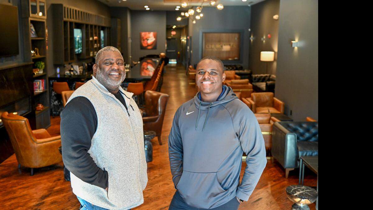 Bruce Riggins, left, owner of Churchills on Cherry, and his son Nicholas Riggins, who has a minority stake in the business.