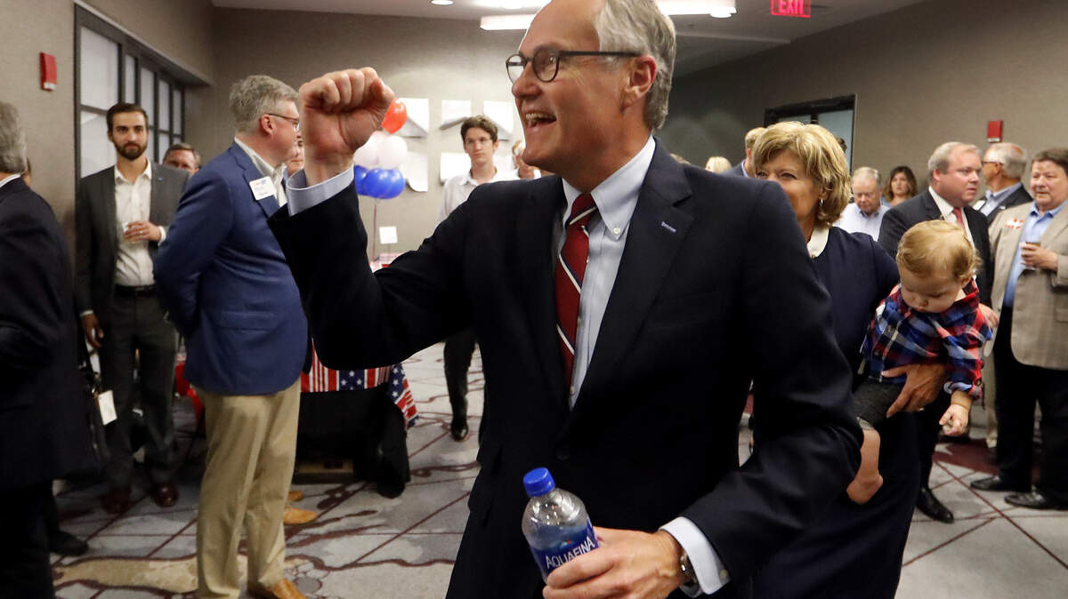 Georgia Republican gubernatorial candidate Lt. Gov. Casey Cagle gestures to supporters as he makes his way to the stage before conceding the runoff election to Secretary of State Brian Kemp during his election-night watch party Tuesday in Atlanta.