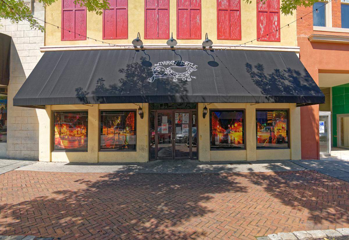 Downtown Thirsty Turtle’s front facade shows a massive 360-degree mural of Macon’s nightlife created by local photographer and digital artist Doug Nurnberger. 